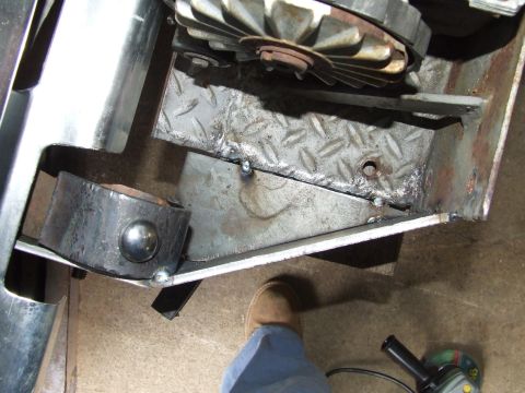 1979 Ford Bronco - Custom fabrication work is shown on a winch bumper, with a person's foot visible in the lower right.