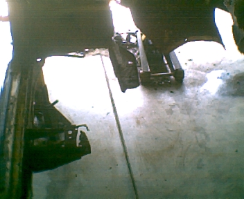 1966 Ford Ranchero - Vehicle is elevated on a lift for maintenance or repair work.
