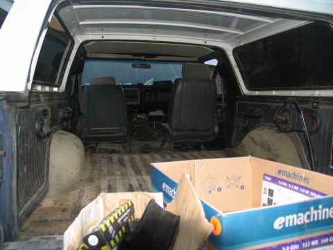 1978 Ford Bronco - Interior view of a 1978 Ford Bronco, with seats and cargo area visible, some wiring exposed.
