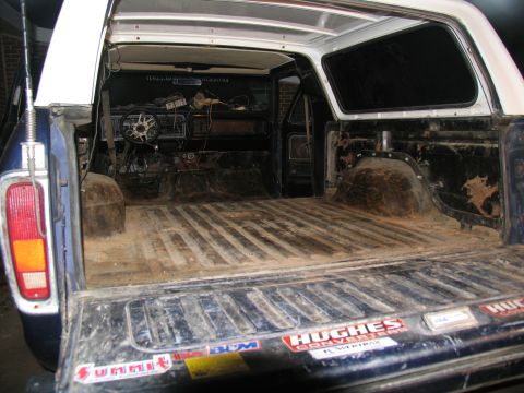 1978 Ford Bronco - The interior of the vehicle is visible, showing the dashboard and the empty cargo area.