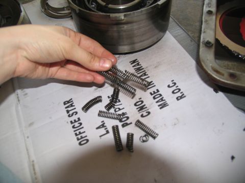 1978 Ford Bronco - Transmission springs and parts laid out on paper with text.