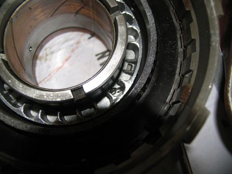 1978 Ford Bronco - Internal view of a transmission component, showing gears and stamped markings.