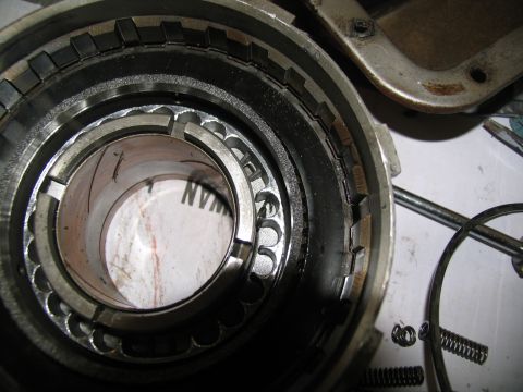 1978 Ford Bronco - A disassembled transmission clutch pack shows intricate metal components and small springs.