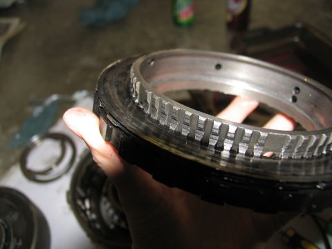 1978 Ford Bronco - A worn transmission clutch pack, likely from a 1978 Ford Bronco, shows significant wear on its teeth.