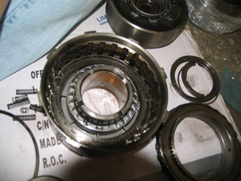 1978 Ford Bronco - Disassembled transmission clutch pack components are laid out on a box for inspection.