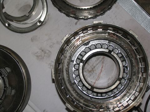 1978 Ford Bronco - Close-up view of disassembled transmission components, including a drum with internal clutch plates and a bearing cage.