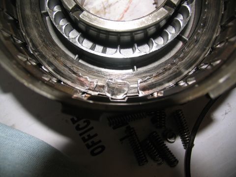 1978 Ford Bronco - Damaged transmission part with visible metal fatigue and broken springs.