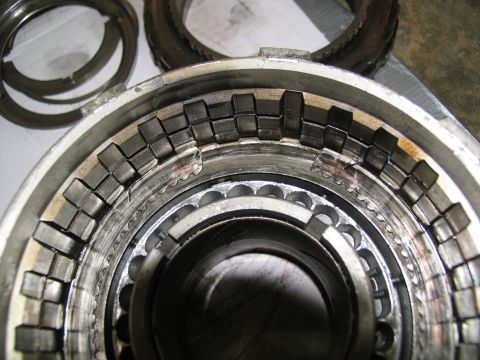 1978 Ford Bronco - A transmission clutch pack shows significant wear and damage, with metal fragments visible.