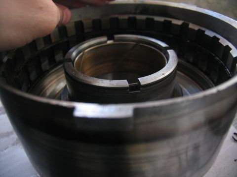 1978 Ford Bronco - A close-up view of a transmission part, likely a clutch drum or similar component, showing internal splines and a central sleeve.