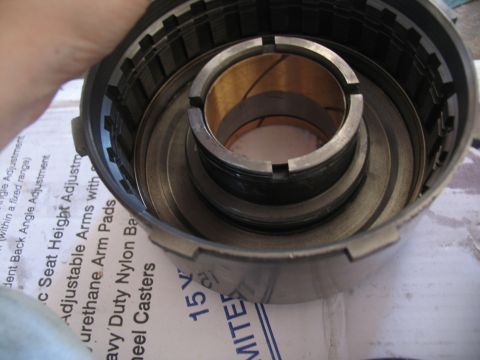 1978 Ford Bronco - Transmission clutch pack components, including metal plates and a central bushing, are visible.