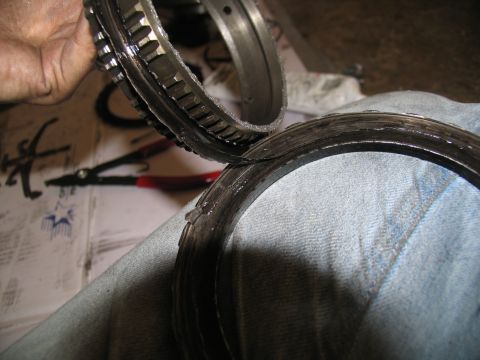 1978 Ford Bronco - Close-up of worn transmission clutch pack rings, indicating internal damage.