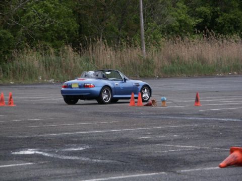 2001 Mercury Grand Marquis - A blue convertible is parked on a paved lot, with orange cones marking a course.