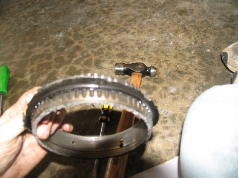 1978 Ford Bronco - A close-up of a damaged transmission component, possibly from a rebuild project.