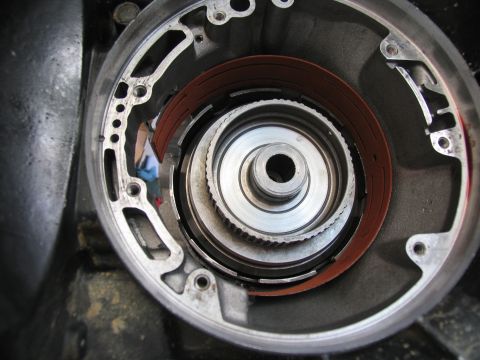 1978 Ford Bronco - Close-up view of a transmission torque converter, showing internal components and red friction bands.