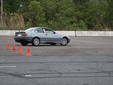 2001 Mercury Grand Marquis - A gray BMW 3 Series Coupe participates in an event, marked with the number 33.