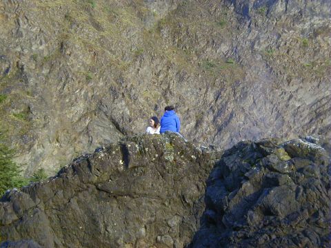 1994 Ford Explorer - Two individuals observe a , mountainous landscape from a high vantage point.
