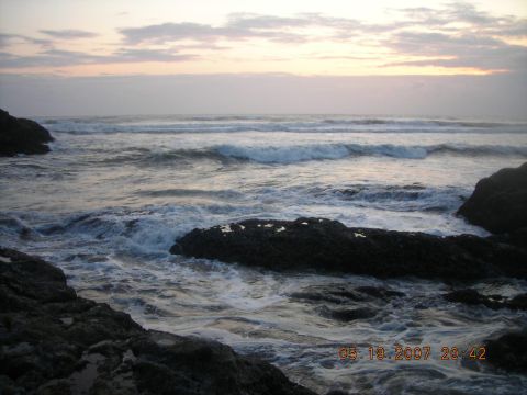 1994 Ford Explorer - The ocean meets the rocky shore with waves breaking under a pastel sky, timestamped May 19, 2007.
