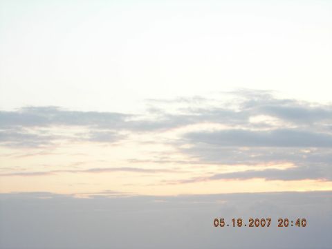 1994 Ford Explorer - The image shows a sky with clouds and a timestamp indicating the date and time.