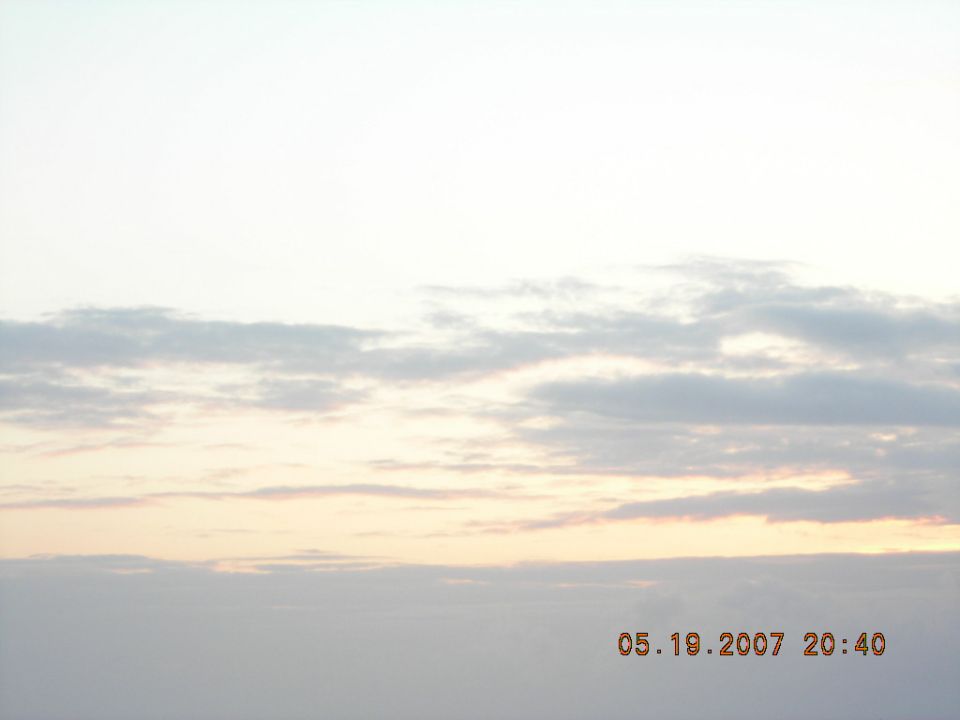 Pale dusk sky with clouds and a 2007 camera date stamp