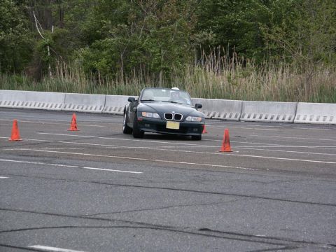 2001 Mercury Grand Marquis - BMW Z3 convertible navigates a course marked by orange cones on a paved track.
