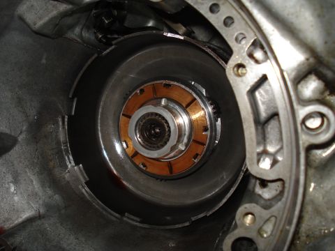 1984 Ford Bronco - Close-up view of a transmission torque converter, showing its internal components including copper clutch plates.