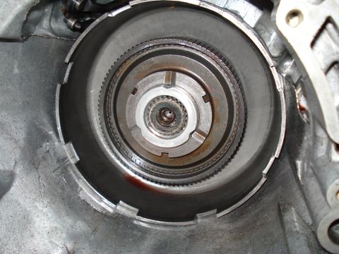 1984 Ford Bronco - Internal view of an automatic transmission, revealing gears and clutch pack assembly.
