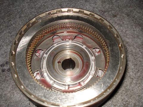 1984 Ford Bronco - Close-up of an automatic transmission clutch pack, showing internal components and friction material.