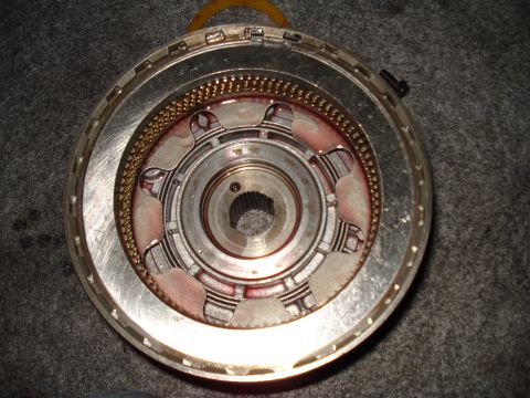 1984 Ford Bronco - Close-up of a transmission clutch pack, showing internal components and wear marks.