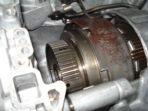 1984 Ford Bronco - A close-up view of internal transmission components, showing a clutch pack and input shaft.