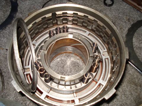 1984 Ford Bronco - A close-up view of a disassembled automatic transmission drum, showing internal components.