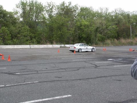 2001 Mercury Grand Marquis - A white coupe with racing number 50 navigates a course marked by orange cones on a paved lot.