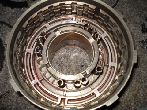 1984 Ford Bronco - Close-up of an automatic transmission drum, showing internal components like clutch plates and springs.