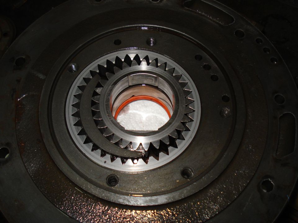 Close-up of a transmission planetary gear set with a damaged sun gear