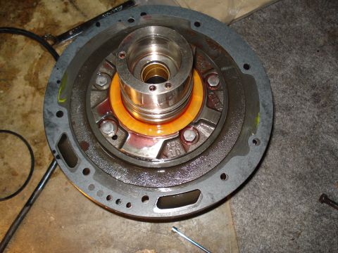 1984 Ford Bronco - Close-up of a disassembled transmission pump, showing internal components and fluid residue.