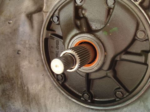 1984 Ford Bronco - Transmission oil pump assembly with splined shaft and orange seal visible.