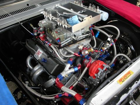 1998 Ford Crown Victoria - A highly modified engine bay shows intricate plumbing and performance parts, not a 1998 Ford Crown Victoria.