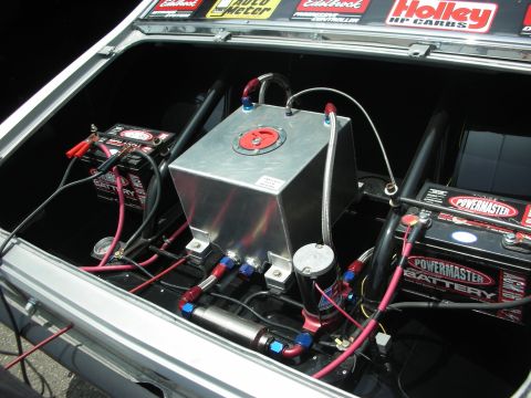 1998 Ford Crown Victoria - Custom trunk setup with fuel cell and dual batteries, likely for a race car.