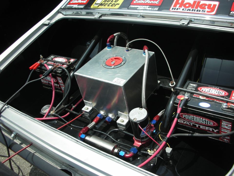 Trunk interior showing a fuel cell, two Powermaster batteries, and associated plumbing