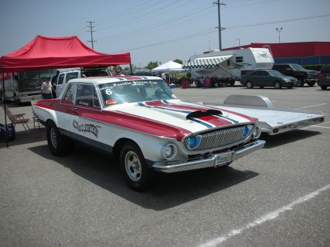 1998 Ford Crown Victoria - A custom red and white drag car with racing stripes and a prominent hood scoop is parked on asphalt.