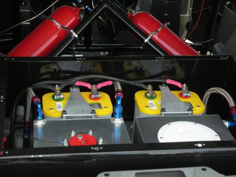 1998 Ford Crown Victoria - Custom setup with dual batteries and nitrous tanks, likely for a performance vehicle.