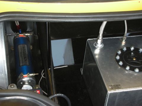 1998 Ford Crown Victoria - Custom fuel system components, including an Accusump and fuel cell, are visible in the trunk of a vehicle.