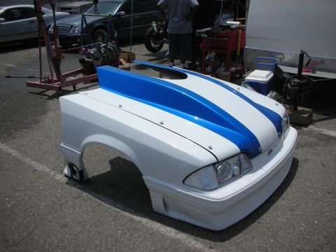 1998 Ford Crown Victoria - Customized Ford Mustang hood and fender assembly with blue racing stripes.