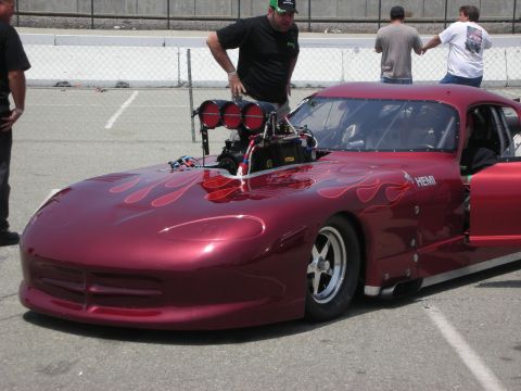 1998 Ford Crown Victoria - Custom drag car with a prominent supercharger and flame graphics.