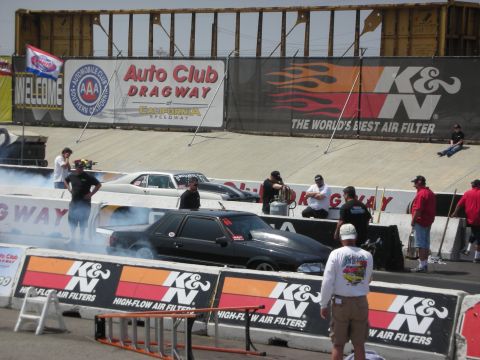 1998 Ford Crown Victoria - Drag cars prepare for a race at Auto Club Dragway, California Speedway.