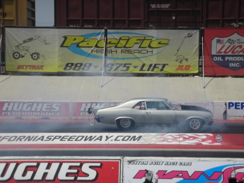 1998 Ford Crown Victoria - A drag car performs a burnout at California Speedway.