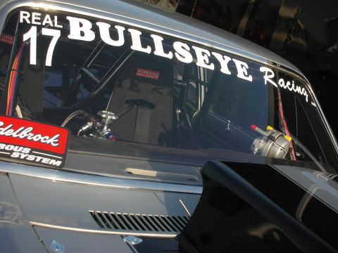 1998 Ford Crown Victoria - A race car's interior is visible through the windshield, racing seats and performance parts.
