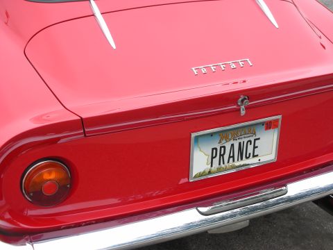 1998 Ford Crown Victoria - Rear view of a red Ferrari with a Montana license plate that reads PRANCE.