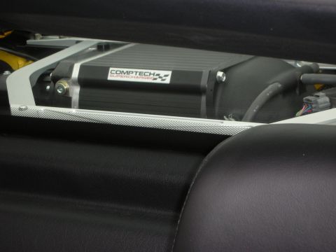 1998 Ford Crown Victoria - A Comptech Supercharger is visible, mounted within a vehicle's interior.