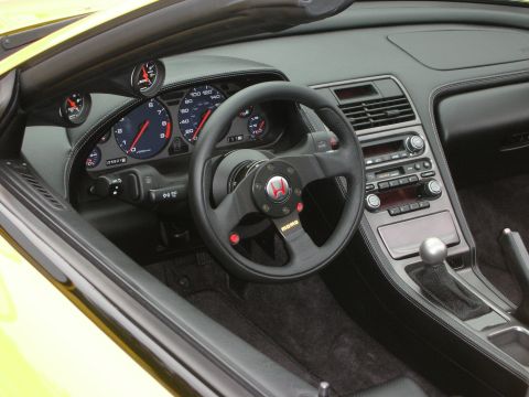 1998 Ford Crown Victoria - Interior view of a sports car, an aftermarket steering wheel and custom gauges.