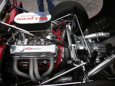 1998 Ford Crown Victoria - Close-up of a Chevrolet engine, identified by its valve covers, with a prominent McLaren branded air filter.